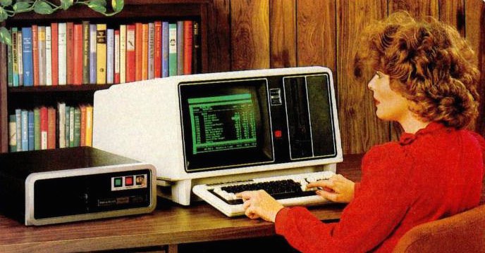 Pictures of women using boxy 1980s computers